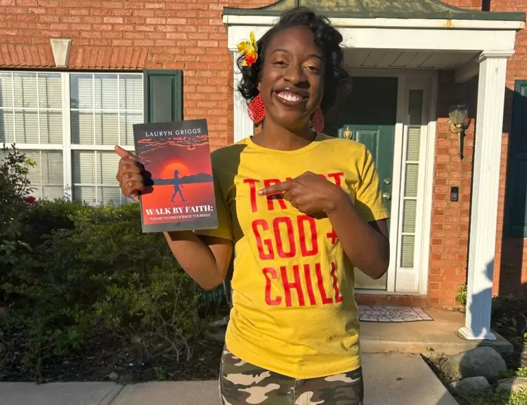 A young woman with a yellow shirt holding a book called "Walk by Faith: Poems to Encourage Yourself".